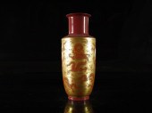 A RED GROUND PAINTED GOLD 'DRAGON'