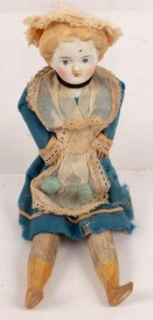 A bisque head doll with wooden