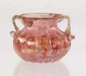A SMALL ROMAN PINK GLASS VASE 1ST-3RD