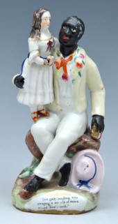 STAFFORDSHIRE FIGURE OF UNCLE TOM AND