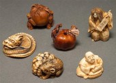 Four Japanese carved ivory netsukes