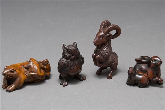 Four Japanese carved wood netsukes