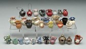 32 miniature pottery vessels: jugs,