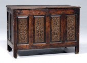 English carved oak lift-top chest, four-panel