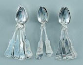 Thirteen coin silver spoons: shaped
