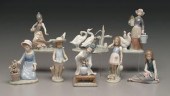 Eight Lladro figurines: girl in straw