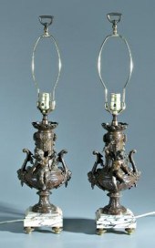 Pair putti figural patinated lamps: