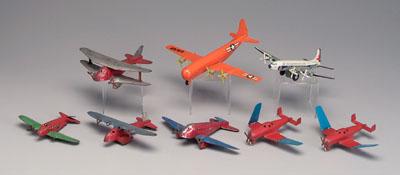 Eight toy airplanes six painted 92d59