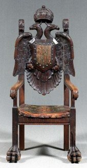 Carved German heraldic armchair, grand