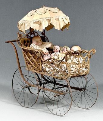 Rattan, wood and steel doll buggy, 48