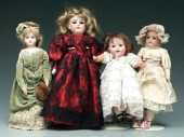 Four bisque head dolls: one with jointed
