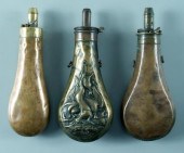 Three brass powder flasks: one possibly