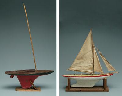 Two wooden toy pond sailers: one marked "Jacrim