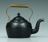 Cast iron kettle with brass handle,