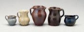Five pottery pitchers one with 95105