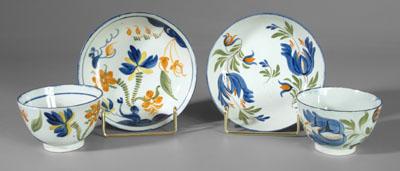 Two pearlware cups and saucers: one with