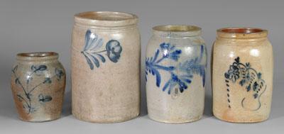 Four stoneware jars, all with blue decoration: