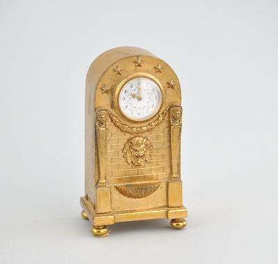 A French Empire Gilt Brass Clock, ca. 19th