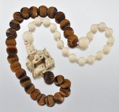 An Impressive Ivory and Tiger Eye Necklace