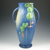 Roseville Fuchsia handled vase in blue.