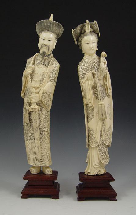 CHINESE CARVED IVORY FIGURES: Elaborate robes