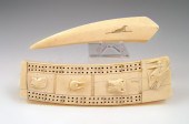 ALASKAN IVORY CRIBBAGE BOARD: With figural