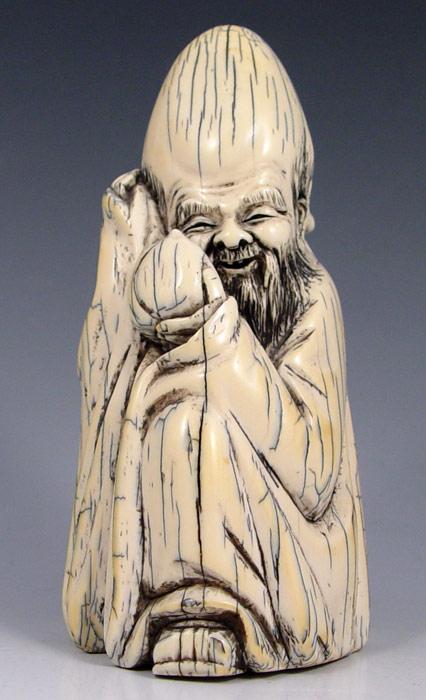 CHINESE CARVED IVORY FIGURE: Figure of man,
