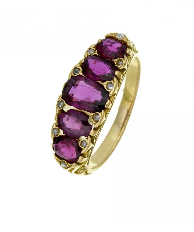 A RUBY FIVE STONE RING
the rubies graduated