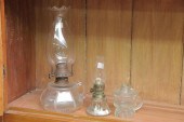 THREE GLASS FINGER LAMPS. Including