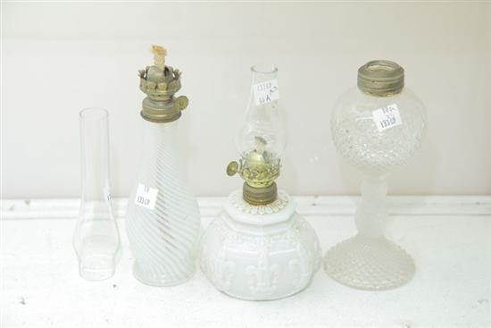 GROUP OF THREE MINIATURE GLASS OIL LAMPS.