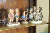 GROUP OF THREE HUMMEL FIGURINES. Including
