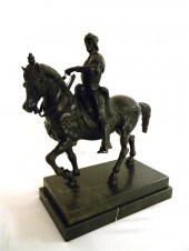 Bronze statue of horse and rider on