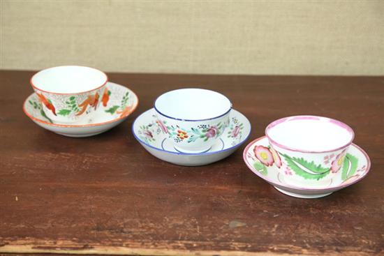 THREE HANDELESS CUPS AND SAUCERS  111c09