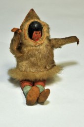INUIT DOLL. Carved and painted wood