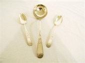 Sterling: Pair of coin serving spoons