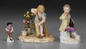 Three Meissen porcelain figures: seated