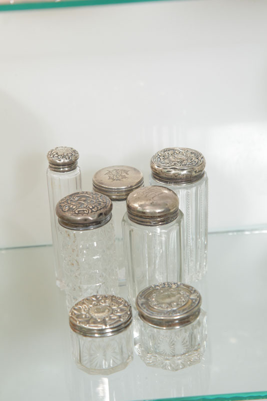 SEVEN SMALL DRESSER JARS WITH SILVER 1172cc