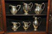 SIX STERLING PITCHERS. All marked Sterling.
