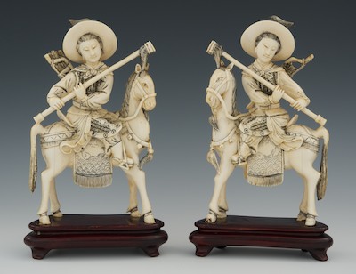 A Pair of Carved Ivory Figures