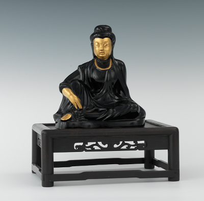 A Black Cast Glass Seated Guanyin 133437