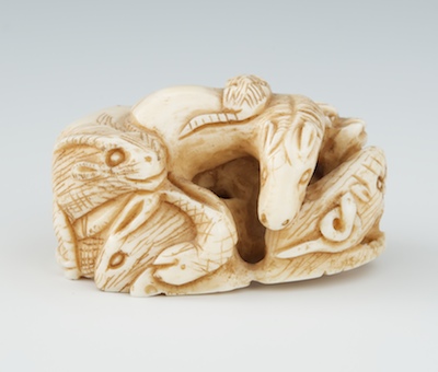 A Carved Ivory Netsuke of Animals 131f42