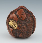 A Lacquered Peach Nut Netsuke Carved