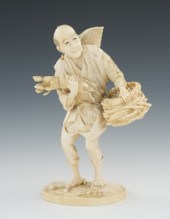 A Carved Ivory Figure of a Farmer The