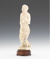 A Carved Ivory Figurine of a Fisherman
