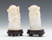 A Pair of Carved Ivory Figures Depicted