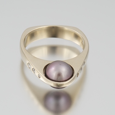 A Contemporary Design Pearl and Diamond Ring