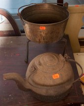 Cast iron tea kettle and a copper cooking