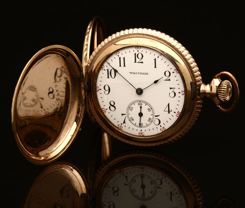 A Waltham 14K gold pocket watch The white