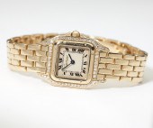 A gold wristwatch Cartier Panthere