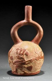 A Pre-Columbian Stirrup Handled Pottery